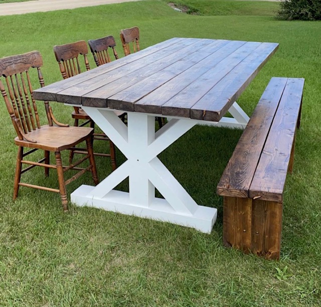 Beautiful wood stained table and bench seats 8 with mismatched wood press back chairs