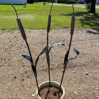 Forged and welded metal cattail plant pokes